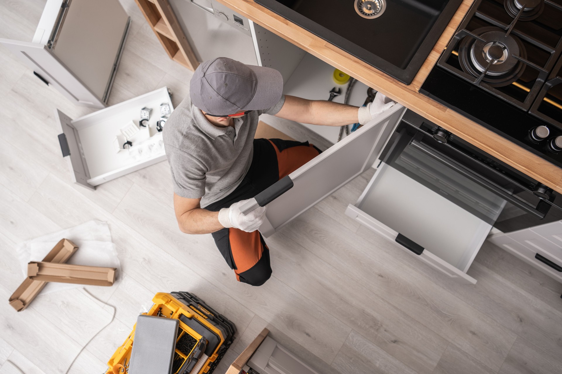 Kitchen Cabinetmaker Installing Furniture Inside a Apartment